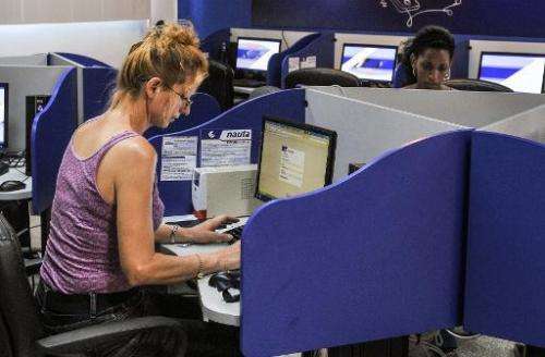 Cubans visit a cybercafe in Havana on June 21, 2013