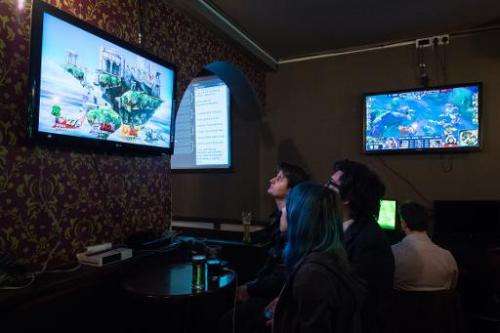 Customers come to the north London pub, pictured on February 14, 2015, to have a drink and watch a video game contest as others 