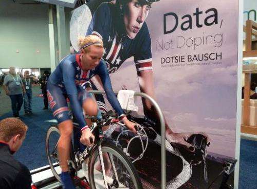 Cycling medalist Dotsie Bausch demonstrates a bicycle at the Consumer Electronics Show on January 7, 2015, in Las Vegas, Nevada