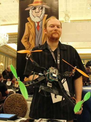 David Jordan displays an Aerial Assault drone during a Def Con hacker gathering in Las Vegas, Nevada, on August 9, 2015