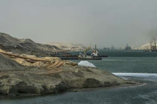 Dredgers are seen at work on the new waterway of the Suez canal, part of an ambitious plan to develop the surrounding area into 
