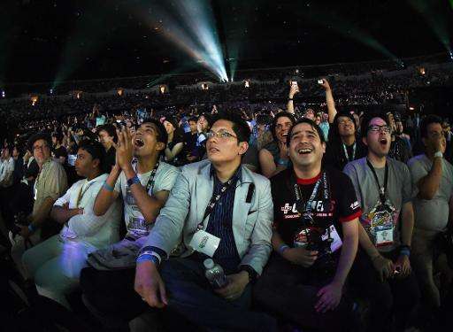 Fans react to announcements of new games ahead of the opening of the Electronic Entertainment Expo, known as E3 on June 15, 2015