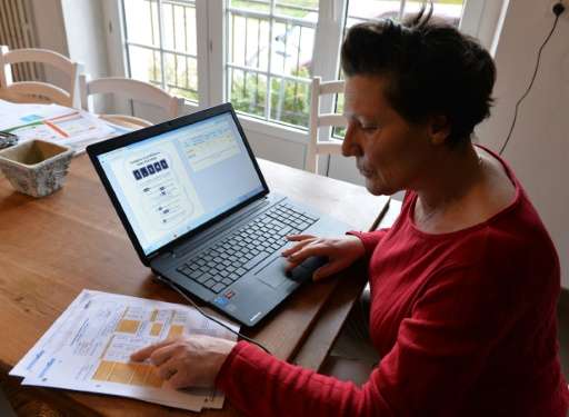 Farmer Marie-Francoise Brizard tracks the savings in greenhouse gas emissions on her computer with an 'Eco-Methane' counter