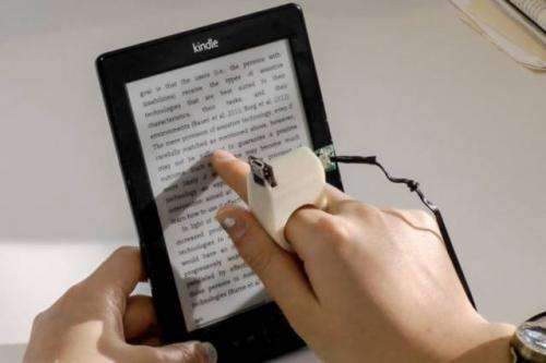 Finger-mounted reading device for the blind