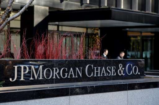 Four people have been charged n a hacking scheme targeting banking giant JPMorgan Chase, whose New York headquarters is pictured
