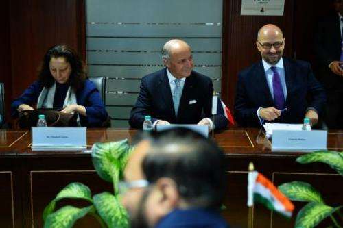 France's Foreign Minister, Laurent Fabius (C), during a delegate meeting in New Delhi on February 5, 2015