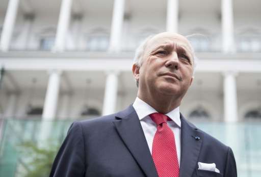 French Foreign Minister Laurent Fabius speaks to the press outside the Palais Coburg Hotel in Vienna, Austria on July 13, 2015