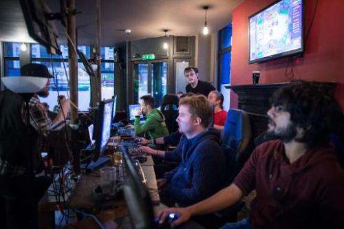 Gamers take part in a tournament at an &quot;e-sports&quot; bar in north London on February 14, 2015