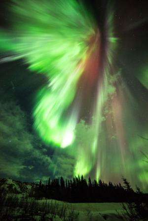 Green and red auroras light up St. Patrick’s day dawn