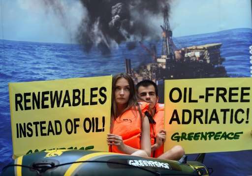 Greenpeace supporters protest against planned oil exploration in the Adriatic in Budapest on July 22, 2015