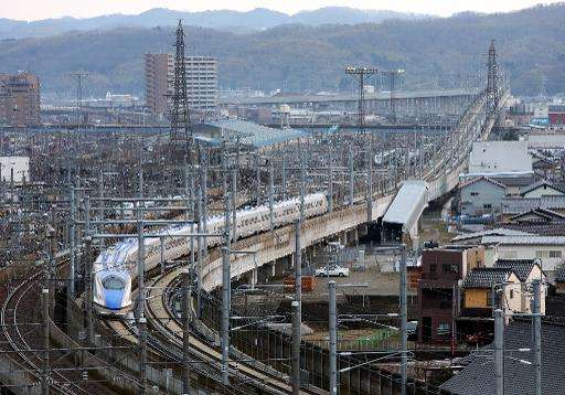 Hokuriku 'shinkansen', or bullet train, heads out of Kanazawa station in Ishikawa prefecture, on March 14, 2015