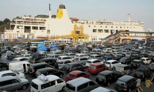 Hundreds of vehicles arrive at Merak port in western Java island on July 15, 2015 to make the ferry crossing to Sumatra island