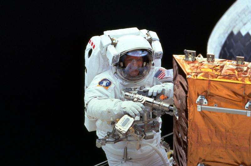 Image: Claude Nicollier repairing Hubble