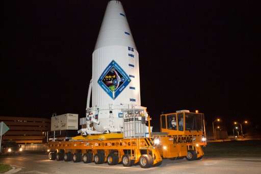 In a handout photo released by United Launch Alliance on December 1, 2015, a transporter moves Orbital ATK's enhanced Cygnus spa