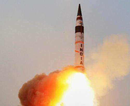 India successfully uses a mobile launcher to test-fire a long-range missile capable of delivering a nuclear warhead into China. 