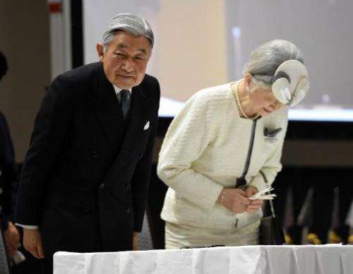 Japanese Emperor Akihito and Empress Michiko bow while attending the opening ceremony of the third UN World Conference on Disast