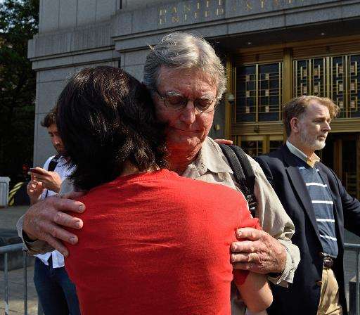 Kirk Ulbricht, father of Silk Road founder Ross Ulbricht, gets a hug from a friend outside the Federal Courthouse May 29, 2015 i