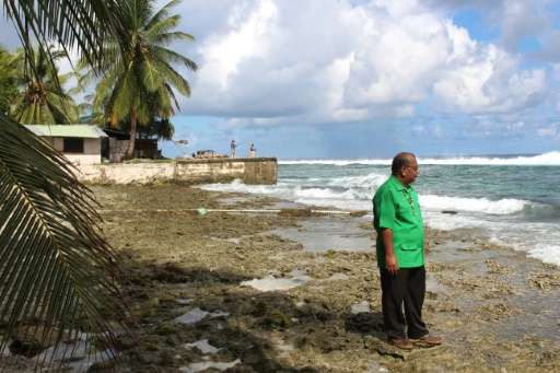 Marshall Islands President Christopher Loeak, pictured in 2014 in front of his home in Majuro, raised the height of a seawall ar