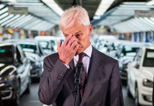 Matthias Mueller, CEO of German car maker Volkswagen, poses before addressing journalists at an assembly line of the VW plant in