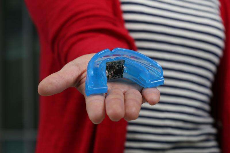 Mouth guard monitors health markers, transmits information wirelessly to smart phone