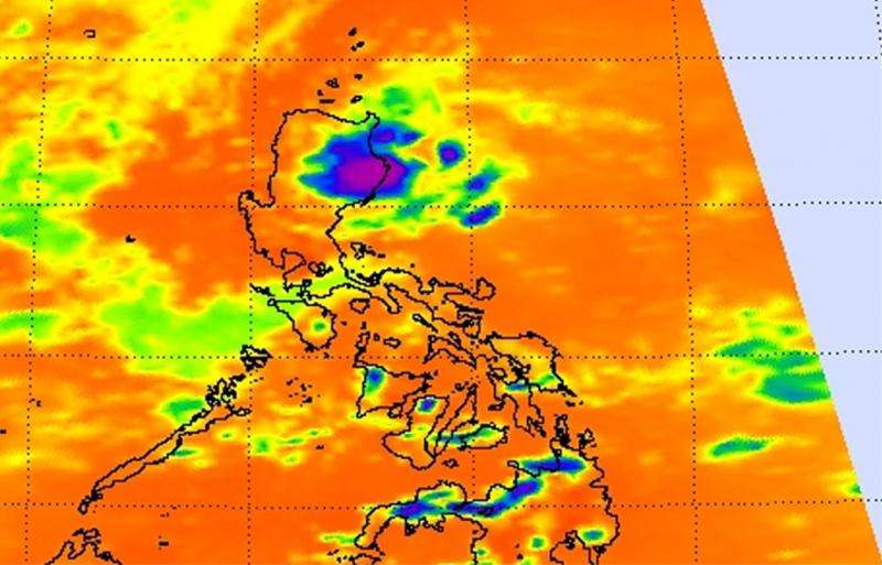 NASA sees newborn Tropical Depression 12W near northeastern tip of Philippines
