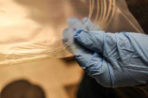 New approach could enable low-cost silicon devices in fibers that could be made into fabrics