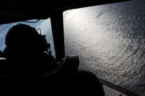 No plane, many discoveries in yearlong search for Flight 370