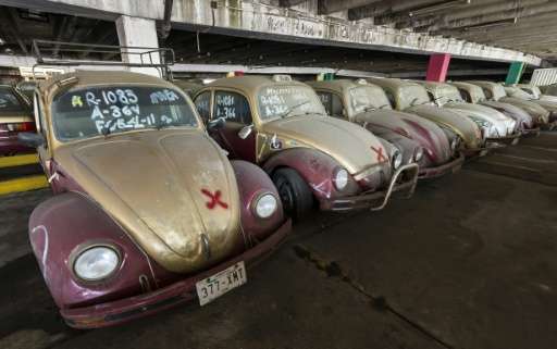Old Volkswagen Beetles, once used as taxi cabs, in a yard for impounded cars in Mexico City on June 23, 2015