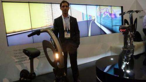 Ori Dadoosh, founder and CEO of Israeli startup Green Ride, with the company's folding electric scooter at the International CES