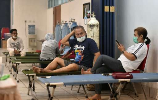 People are treated at a local hospital with fresh oxygen in Palangkaraya, the city worst-hit by toxic haze