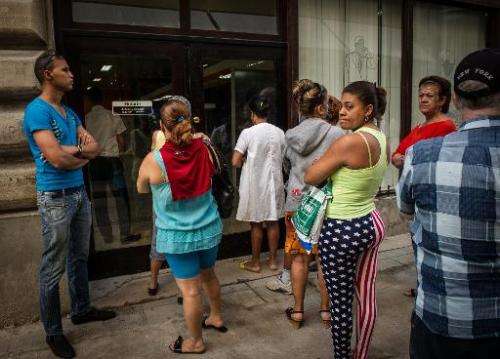 People queue at an Internet service provider in Havana, on January 20, 2015