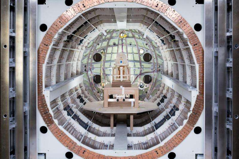 Probing the secrets of the universe inside a metal box