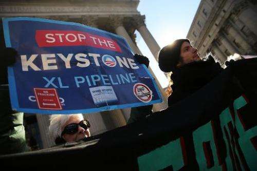 Protesters participate in an anti-Keystone pipeline demonstration in New York's Foley Square on November 18, 2014