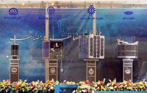 Prototypes for four Iranian home-built satellites (from L) Rasad, Amir Kabir-1, Zafar and Fajr on display during their unveiling