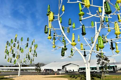 &quot;Wind trees&quot; with &quot;leaves&quot; that act as a mini wind-turbine to generate electricity, are displayed at the COP