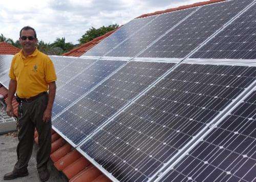 Raul Vergara, president of Cutler Bay Solar Solutions, stands near his latest solar installation on February 20, 2015 at a mansi
