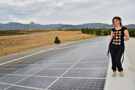 Rosetta Fanari posing on the roof of her &quot;Nuova Sarda Industria Casearia&quot; using a photovoltaic system to supply the en