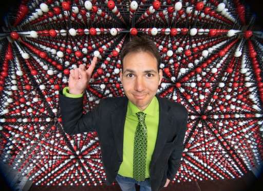 Scientist Dr Robert Krickl poses in front of his crystal structure model, registered as largest model of this type in the Guinne