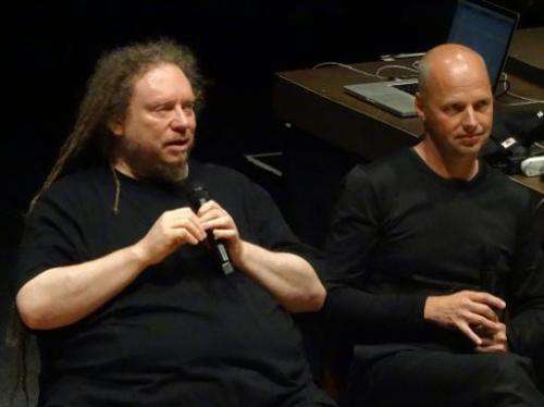 Sebastian Thrun (R), the founder of the Google X research library, looks on as virtual reality pioneer Jaron Lanier speaks at a 