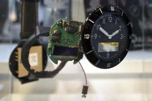 The clock Navigil S1 is presented in disassembled pieces during the 2015 Mobile World Congress in Barcelona on March 4, 2015