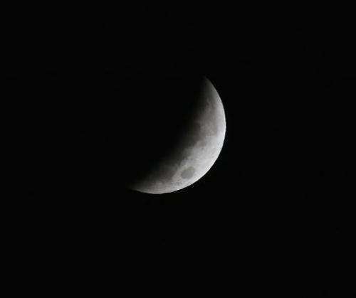 The earth's shadow covers the full moon during a lunar eclipse October 8, 2014 in Washington, DC