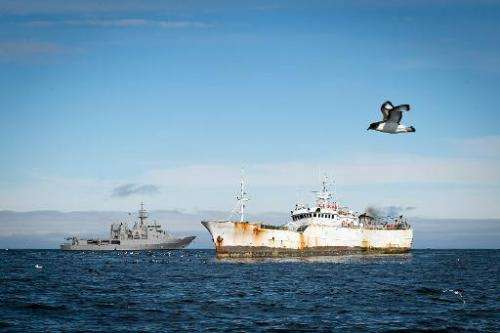 The HMNZS Wellington (L) is seen in a standoff with the suspected poaching ship Kunlun in Antarctic waters, January 14, 2015 in 