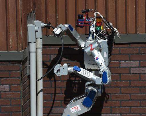 The humanoid robot 'DRC-Hubo' developed by Team KAIST from South Korea completes a task before winning the finals of the DARPA R