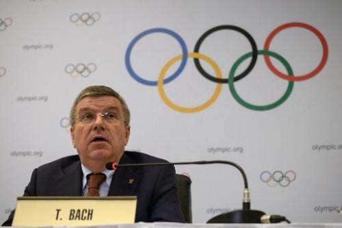 The president of the International Olympic Committee, Thomas Bach speaks to the media at the end of an IOC Executive Board meeti