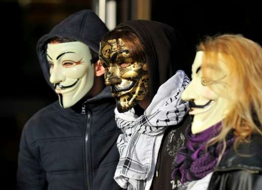 The &quot;Anonymous&quot; hackers collective, represented here by mask-wearing demonstrators at a French trial November 9, 2015,