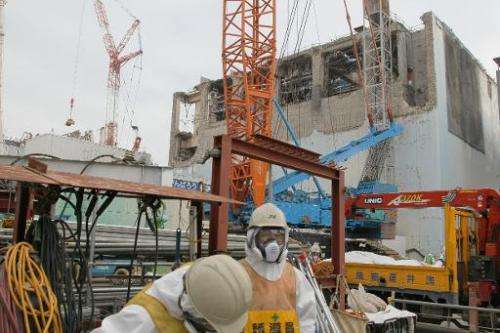 The unit four (right) and unit three (left) reactor buildings at the Fukushima Dai-Ichi nuclear power plant on March 1, 2013