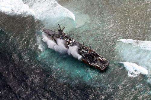 The USS Guardian, a US Navy minesweeper, is pictured trapped on the Tubbataha Reef in January 2013