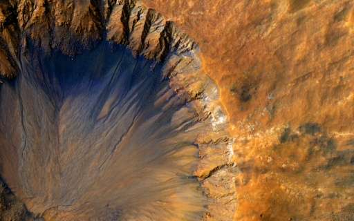 This NASA/JPL/University of Arizona image obtained June 7, 2015 shows a close-up of a &quot;fresh&quot; impact crater in the Sir