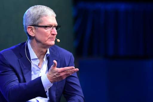 Tim Cook, CEO of Apple, gestures while responding to questions on October 19, 2015 in Laguna Beach, California at the opening of