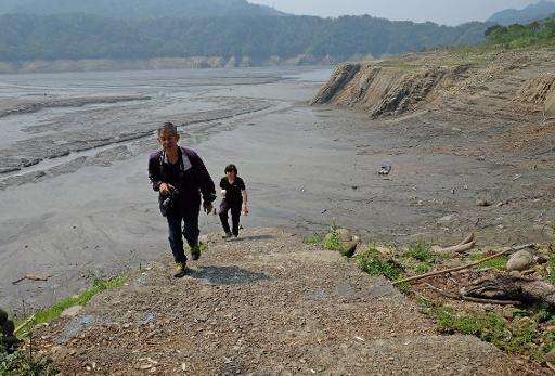 Tourists visit drought-affected Shihmen Dam in northern Taoyuan, Taiwan, on March 20, 2015